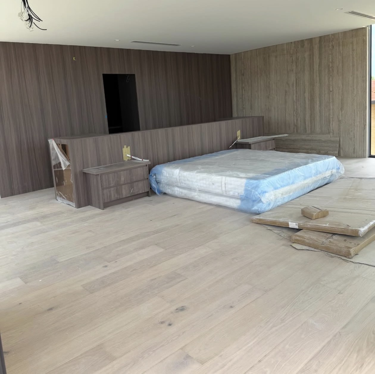 Real NPV FLOORS luxury wide plank flooring installation in a Palm Desert primary bedroom