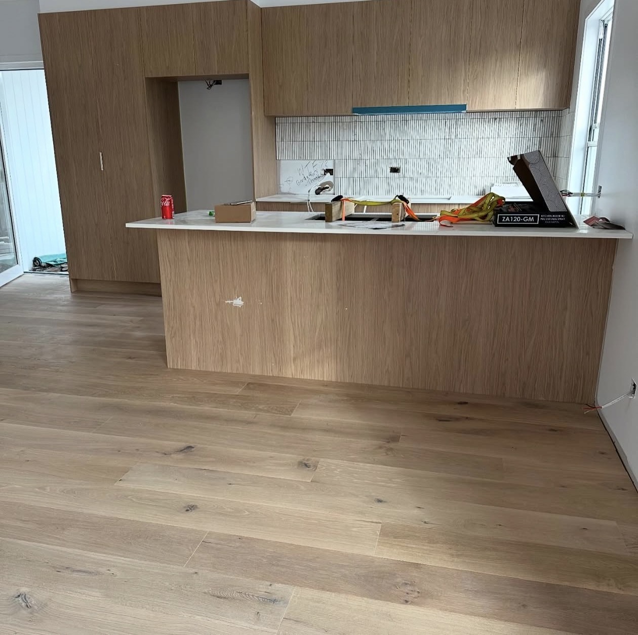 Real NPV FLOORS natural grade oak floor installed in a Palm Springs new construction kitchen