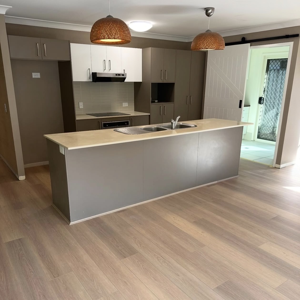 Real NPV FLOORS warm timber plank installation in a Palm Springs residential kitchen