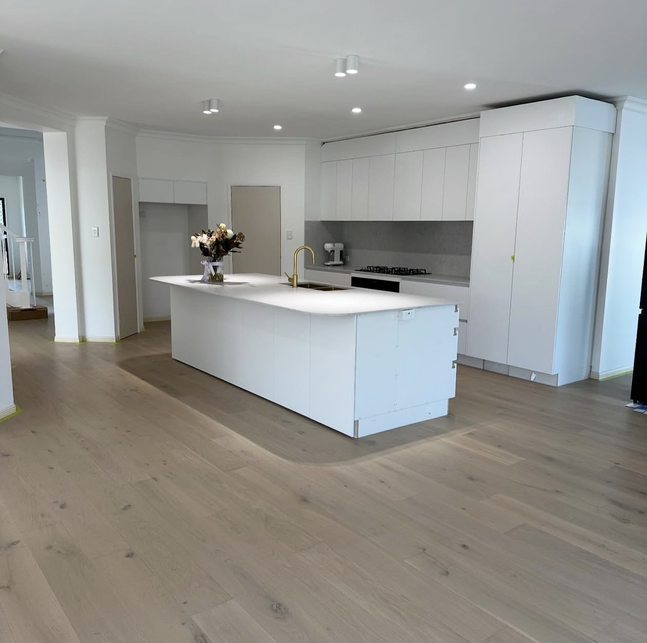 Real NPV FLOORS light oak plank flooring in a remodeled Coachella kitchen